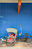 Trishaw in front of historic Cheong Fatt Tze Mansion, Georgetown, Penang, Malaysia, Asia