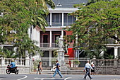 People and statue in front of Government House, Port Louis, Mauritius, Africa