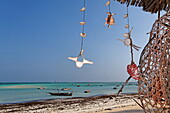 Deserted beach and boats at Nungwi village, Nungwi, Zanzibar, Tanzania, Africa