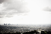 Los Angeles Skyline and Griffith Observatory Beneath Cloudy Sky, Los Angeles, California, USA