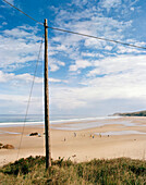 Power pole, Playa de Meron, San Vicente de la Barquera, Parque Natural de Oyambre, Cantabria, Spain