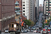 Traditional tram climbing up a mountain, hills in downtown SF, San Francisco Municipal Railway (Muni), view down the steep road, San Francisco, California, United States of America, USA