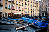 Gondolas moored along a canal in Venice, Italy