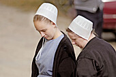 Amish of the American Heartland: Ohio, Indiana, Pennsylvania. Family at market, Mother and Daughter