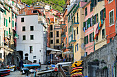 Multi-coloured houses and boats of Riomaggiore, Riomaggiore, Cinque Terre, UNESCO World Heritage Site Cinque Terre, Mediterranean, Liguria, Italy