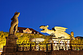 Illuminated fountain Lindwurmbrunnen with Lindwurm and Hercules at night, Neuer Platz, Klagenfurt, Carinthia, Austria, Europe