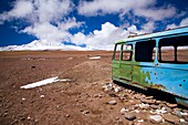 Bolivia, Southern Altiplano, Portezuelo del Cajon Abandonded bus shell rustin near the Chilean Border