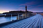 England, North Yorkshire, Whitby Looking from the entrance piers of Whitby Harbour at dawn