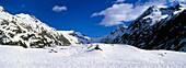 Italy, Valle d Aosta, Gran Paradiso National Park Snow remains well into spring in the peaks of the landscape near Bardoney