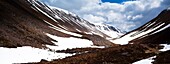 Scotland, Scottish Highlands, Cairngorms National Park The remnants of an harsh winter in the wild valley of the Lairig Ghru
