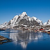Scenic village of Reine in winter with snow covered moutnains, Lofoten Islands, Norway