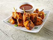 Traditional oriental satay with chilli dipping sauce