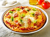 Pizza topped with 3 cheeses, Parma ham & basil