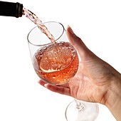 Rose wine being poured into a glass