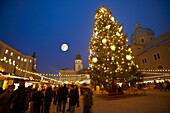 Christmas market stalls and Christmas tree at night at Satlzburgh market - Austria