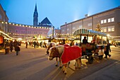 Christmas market stalls at night with Christams lights at Satlzburgh market - Austria