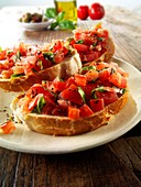 Fresh chopped beefsteak tomato bruschettas