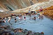 Tourists Bathing in a Natural Hot Spring on the Kerlingarfjoll Mountains, Highlands of Iceland, Europe