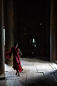 Bagaya Kyaung monastery, Inwa, Myanmar, monk running