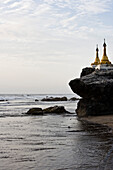 Two pagodas on top of rocks at Ngwe Saung Beach, Myanmar