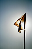 Flag, sun in background