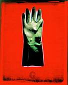 Rubber glove on red background