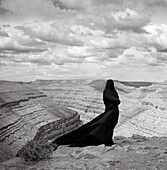 Woman Shrouded in Black Overlooking Grand Canyon