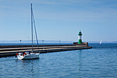 Lighthouse and sailing boats in the harbour, Sassnitz, Ruegen island, Baltic Sea, Mecklenburg-West Pomerania, Germany