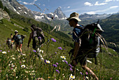Italy, Aosta valley, near Breuil-Cervinia, trekkers, Matterhorn in background