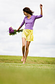 Young woman holding a bouquet of flowers