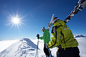 France, Alps, Hautes Alpes, Champsaur valley, two skiers walking in snow
