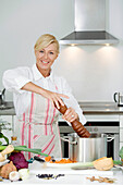 Mature woman cooking