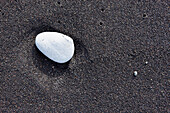 Canary Islands, La Palma, close-up of pebble on volcanic sand
