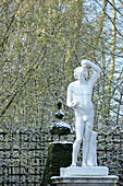 France, Ile de France, Yvelines, Versailles castle, statue in the park in winter