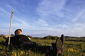 France, Aveyron, Santiago pilgrim resting in Aubrac