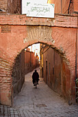 Man on Bicylcle Under Archway in Medina, Marrakesh, Morocco