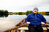 Man Rowing a Boat, Hälsingland, Sweden