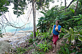 German mother with her baby hiking along the coast, lush green jungle, Khao Lak Lamru National Park, Andaman Sea, Indian Ocean, Khao Lak, Thailand, Asia