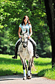 Woman riding a horse, Inn Valley, Upper Bavaria, Bavaria, Germany