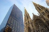 St. Patrick's Cathedral next to a high rise building, Manhattan, New York, USA, America