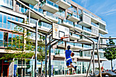 Children playing basketball, HafenCity, Hamburg, Germany