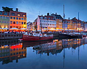 Cafes and restaurants in Nyhavn in the evening light, Copenhagen, Denmark