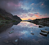 Reflection of the mountains in Lake Vallula, Vallüla, Silvretta, Bieltal, Tyrol, Austria