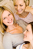 Three smiling women, indoors