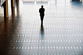 Man walking at airport, rear view