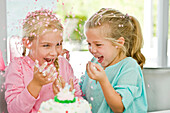 Two girls enjoying a birthday party