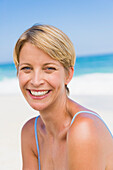 Portrait of a woman smiling on the beach