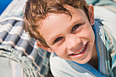 Portrait of a boy smiling on the beach
