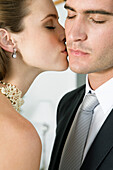 Bride kissing groom