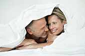 Couple wrapped in a duvet
